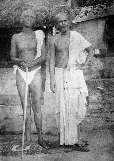 Bhagavan standing with Kavyakantha Ganapati Muni